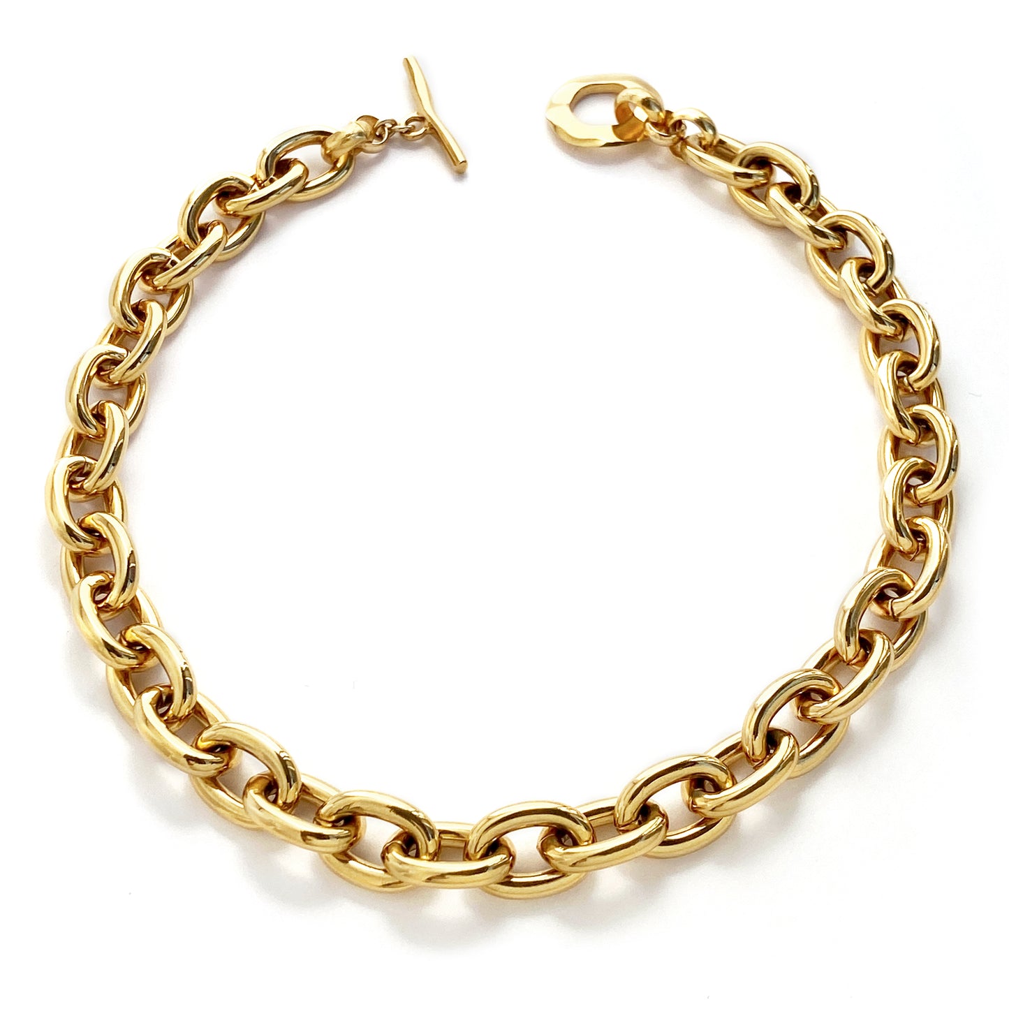 Judith and Charles x Biko gold oversized oval chainlink necklace with hand-cast links and 14k gold plating. Toggle clasp can be worn front or back for versatile day-to-night styling. 17.25" length, hypoallergenic. Style BK-W2504, made in Toronto, Canada.