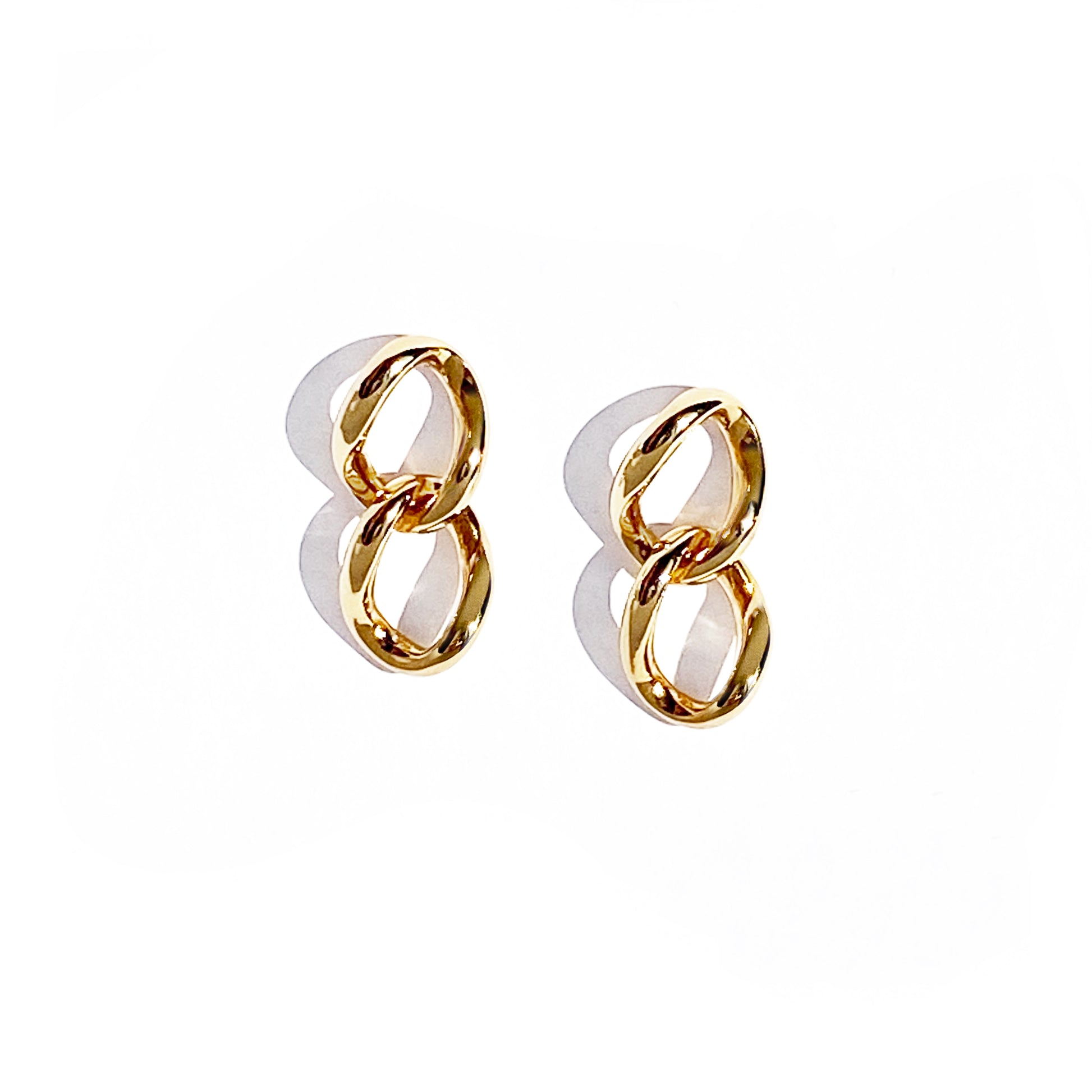 udith and Charles x Biko gold mini double link earrings, hand-cast and polished, worn on model. Subtle yet strong everyday essentials with 14k gold plating and hypoallergenic posts. 0.4" width, 0.9" drop. Style BK-W2508, made in Toronto, Canada