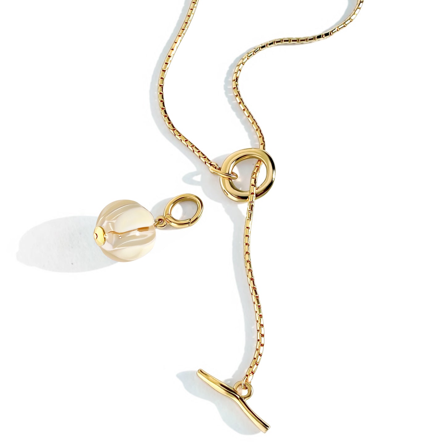 Judith and Charles x Biko gold hand-blown glass bead necklace with custom-painted pendant on 33" vintage box chain. Versatile design with toggle clasp can be worn double wrapped, long, or with pendant detached for solo styling. 1.5" pendant drop, 0.75" bead, 14k gold plated, hypoallergenic. Style BK-W2501, made in Toronto, Canada; beads artisan-crafted in Istanbul, Turkey.