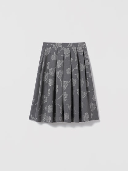 Grey floral jacquard skirt in stretch virgin wool by Loro Piana, below-the-knee length with side seam pockets, clean waist, and invisible back zipper. Unlined. Made in Canada with Italian fabric. Mecca Skirt, style 725-2531 by Judith & Charles